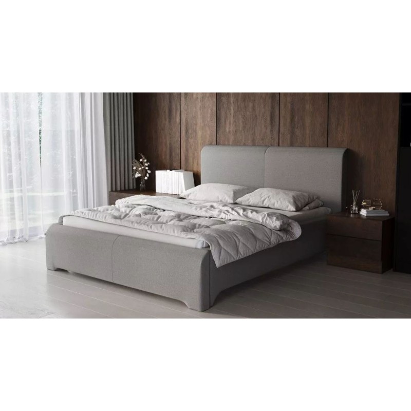 szare tapicerowane łóżko 