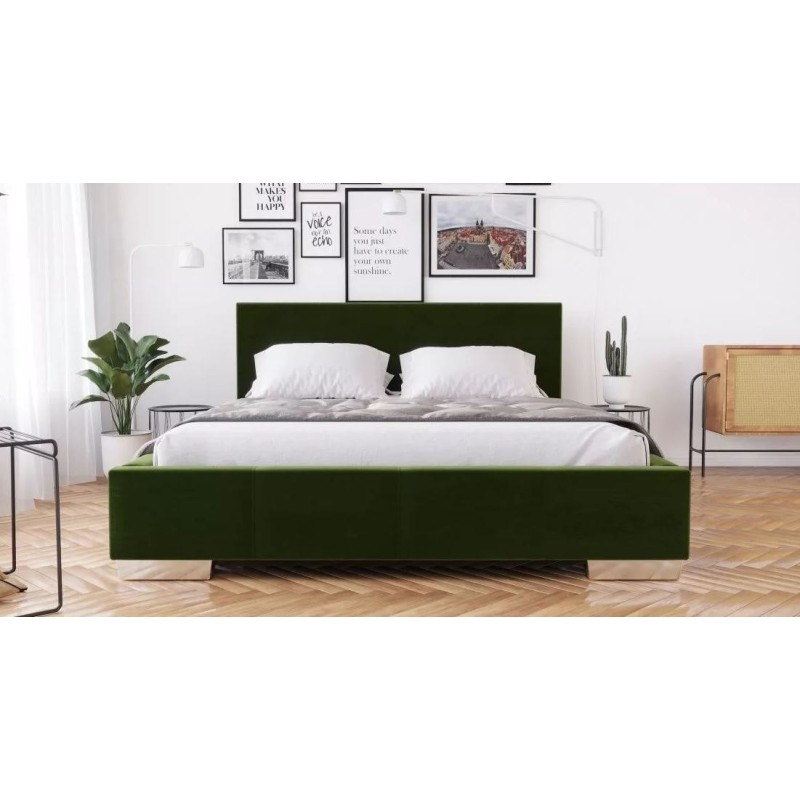 ciemnozielone łóżko 