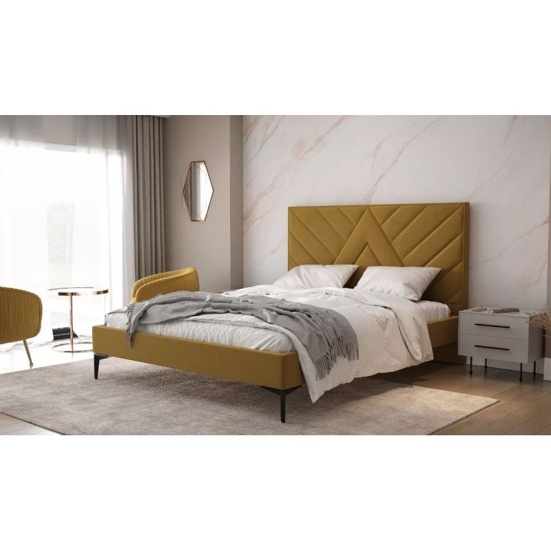 Łóżko pikowane w musztardowym kolorze 