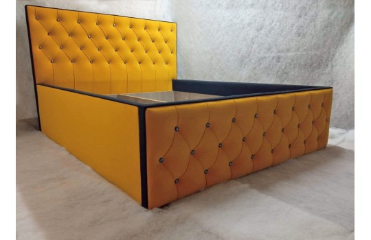 Żółte łóżko tapicerowane z pojemnikiem Elise 