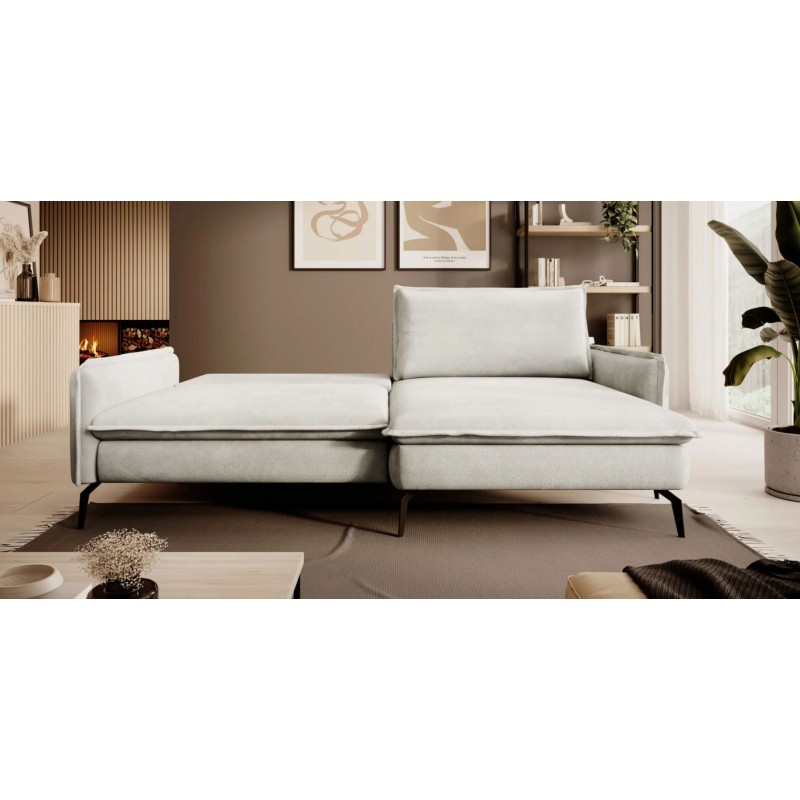 sofa narożna w kremowym kolorze 