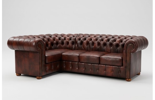 Narożnik chesterfield Noble z krótszym ramieniem w brązowej skórze Narożnik chesterfield Noble z krótszym ramieniem w brązowej skórze