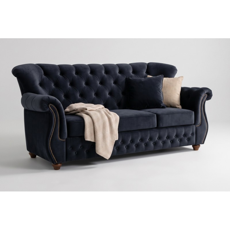 Granatowa sofa chesterfield James 190 cm z wysokim pikowanym oparciem i kocem na siedzisku
