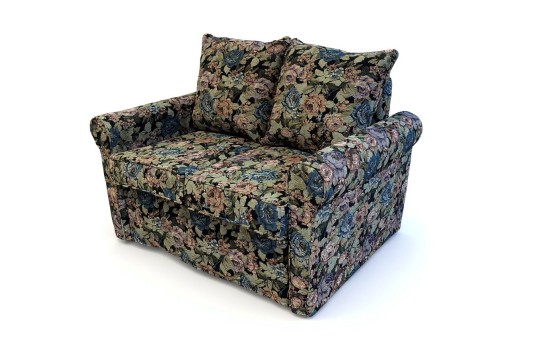 sofa w materiale w kwiaty 
