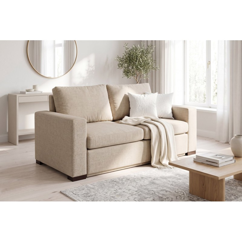 Beżowa sofa Riga z funkcją spania w jasnym wnętrzu