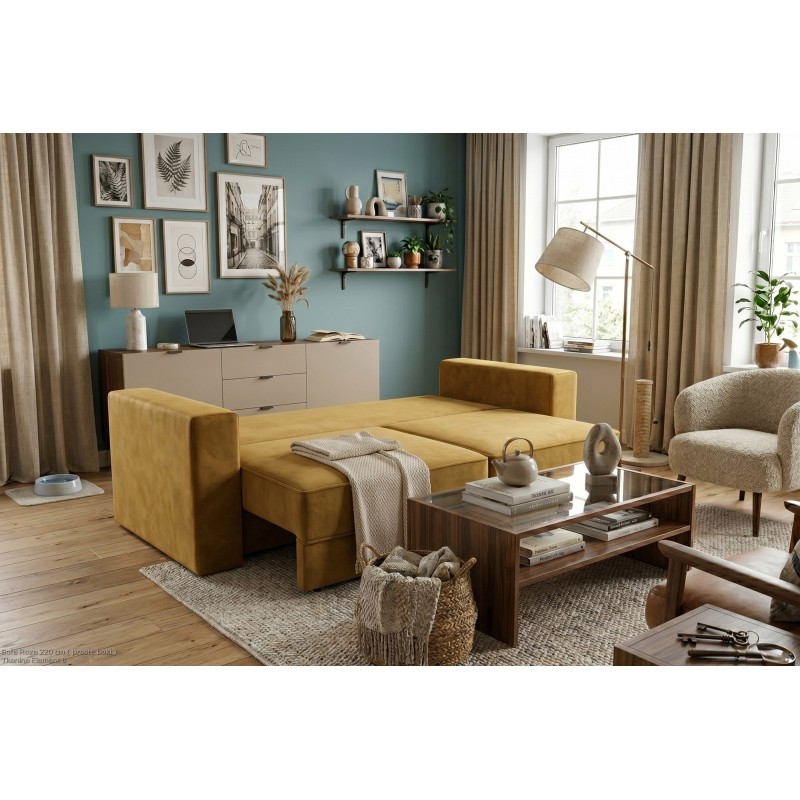 Rozłożona sofa Roza z pościelą i kocem przygotowana do spania w salonie Rozłożona sofa Roza z pościelą i kocem przygotowana do spania w salonie