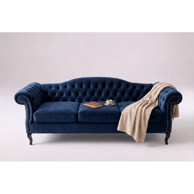Granatowa sofa chesterfield Solano z jasnym pledem na białym tle Granatowa sofa chesterfield Solano z jasnym pledem na białym tle