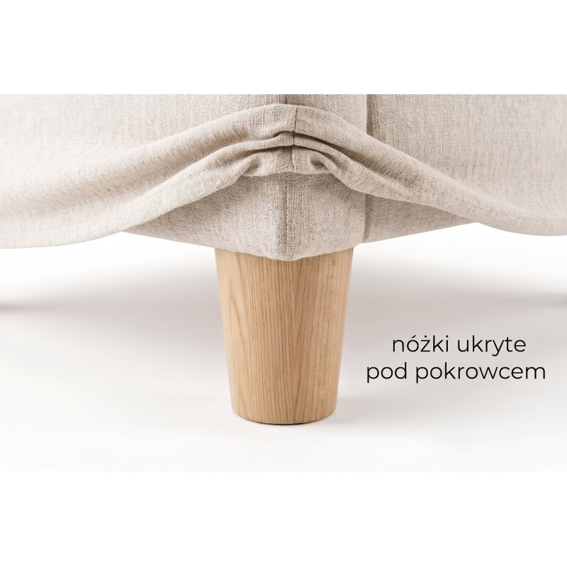 Detal toczonej nóżki ukrytej pod pokrowcem sofy Piuma 250 cm Detal toczonej nóżki ukrytej pod pokrowcem sofy Piuma 250 cm