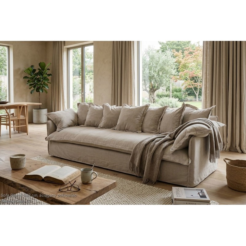 Sofa Piuma 250 cm, widok z boku w jasnym pokoju dziennym ze stolikiem kawowym Sofa Piuma 250 cm, widok z boku w jasnym pokoju dziennym ze stolikiem kawowym