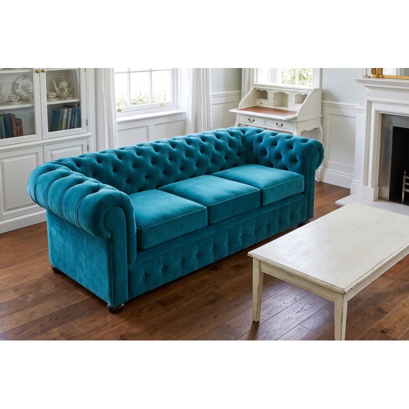 Turkusowa sofa Chesterfield Retro z trzema siedziskami przy kominku Turkusowa sofa Chesterfield Retro z trzema siedziskami przy kominku