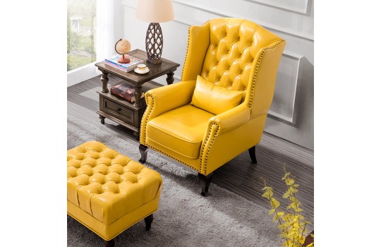 żółty pikowany fotel do salonu z pufą Kordian 