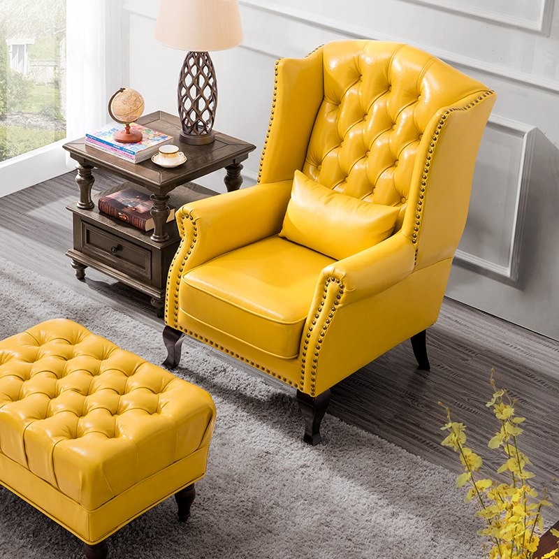 żółty pikowany fotel do salonu z pufą Kordian 